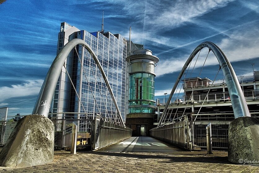 Footbridge near Basingstoke Bus Station, with modern glass building in the background