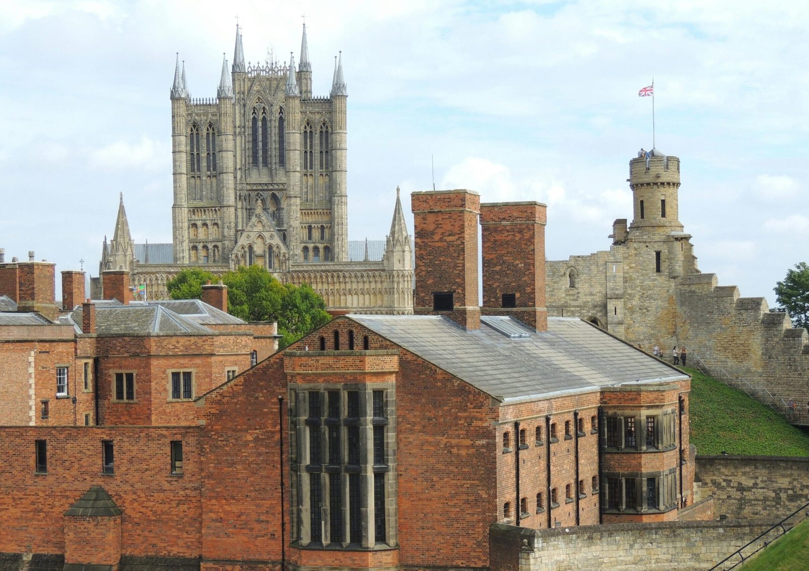 Stunning view of Lincoln Cathedral and nearby historic architecture on a sunny day.