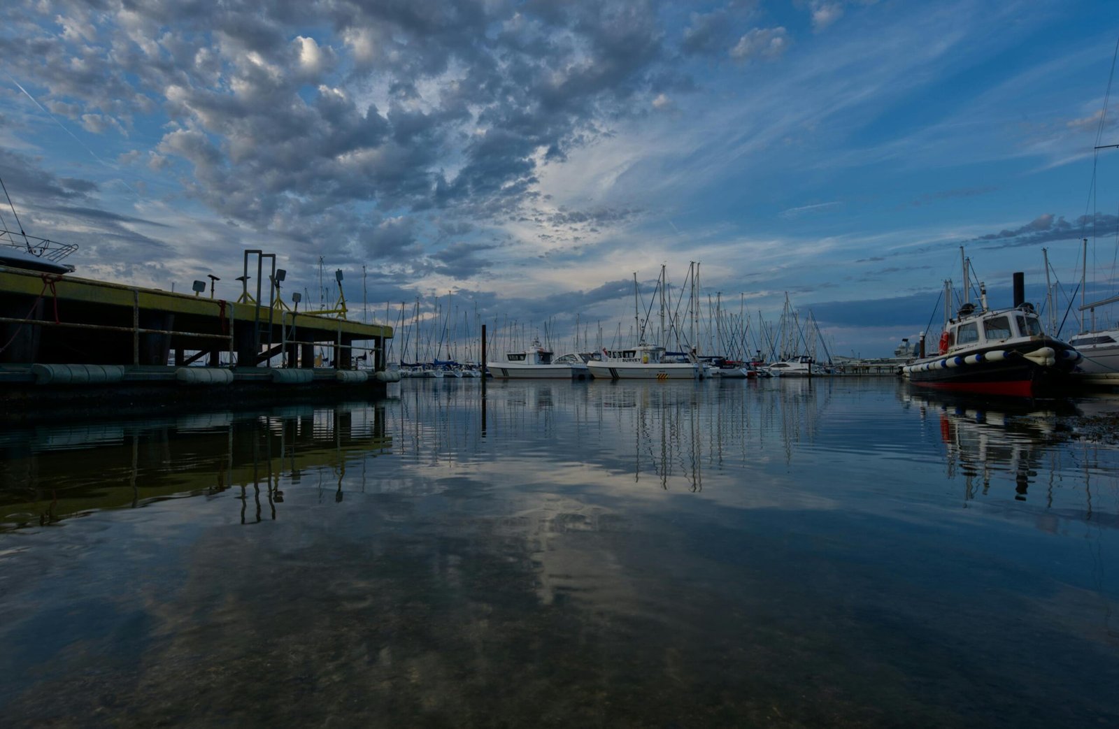 Beautiful view of boats and reflections in Gosport Marina during a serene evening.