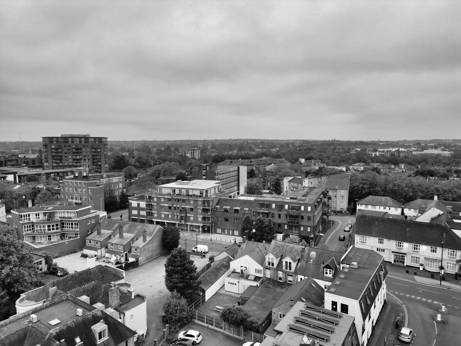 Black and white aerial photo of Chelmsford, showing urban buildings and surrounding landscapes.
