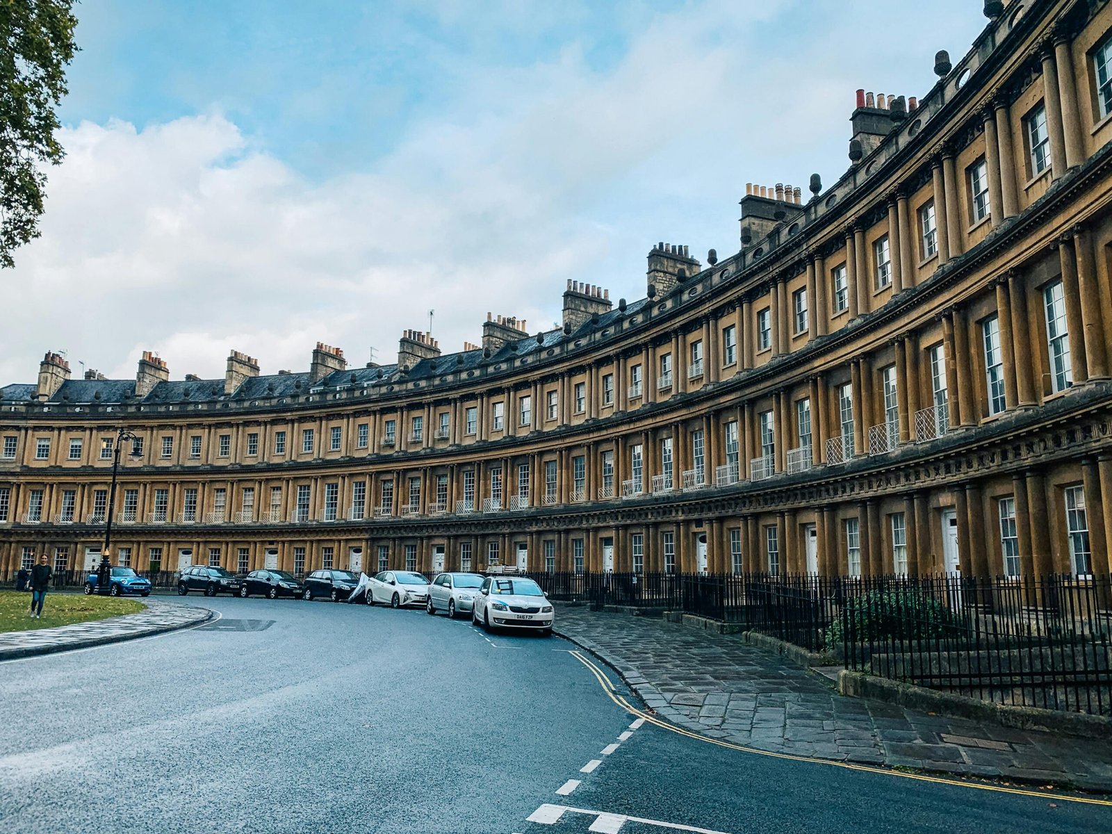 The iconic curved facade of the Royal Crescent in Bath, showcasing Georgian architecture.