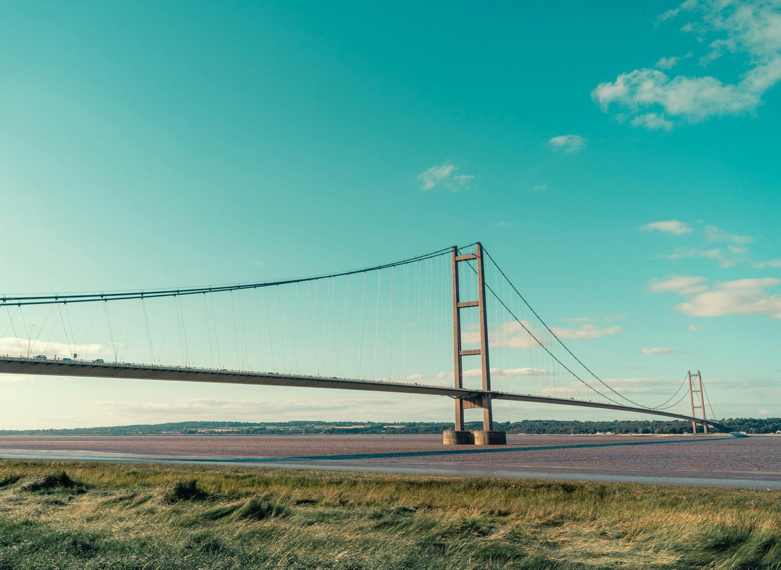A breathtaking view of the Humber Bridge stretching over the Humber Estuary in England.