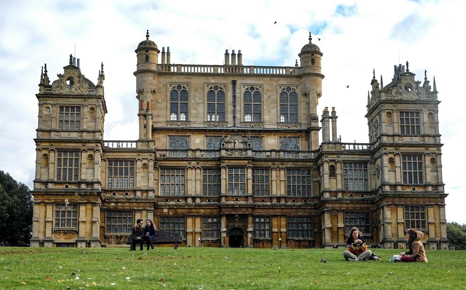 Wollaton Hall, a famous Elizabethan mansion in Nottingham, with people enjoying the park