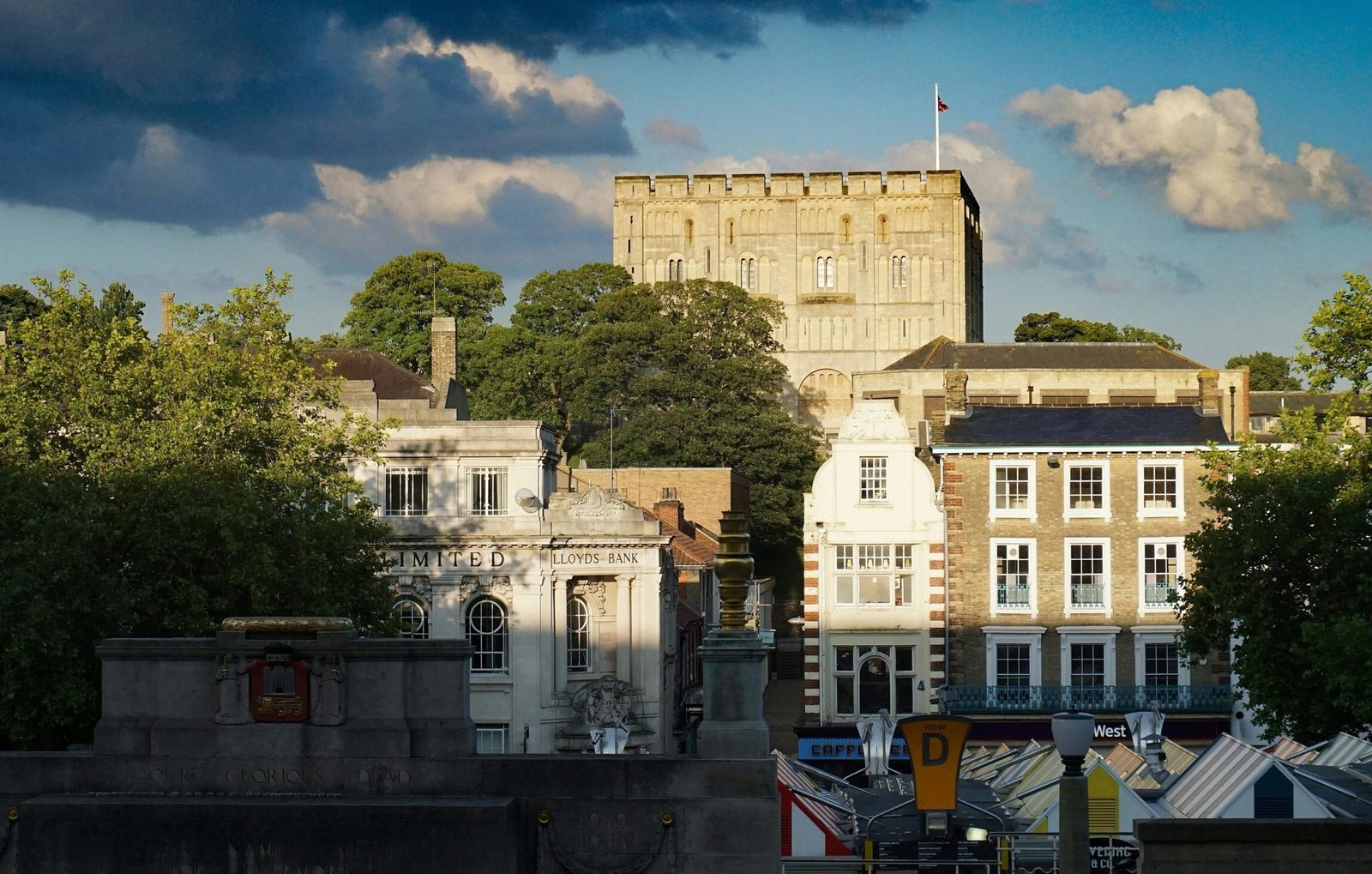 Beautiful view of Norwich Castle and cityscape under a dramatic sky with clouds.